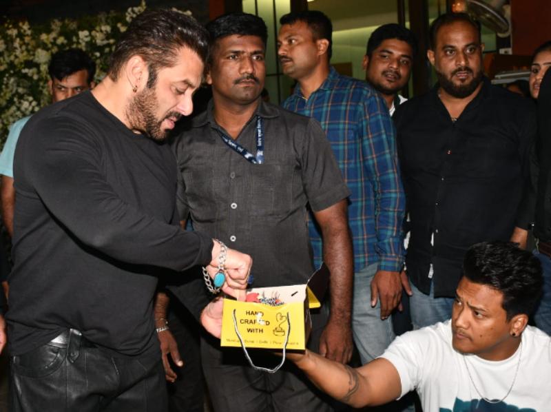 Celebrating with media: Salman celebrated his special day with paps by cutting a cake with them.
